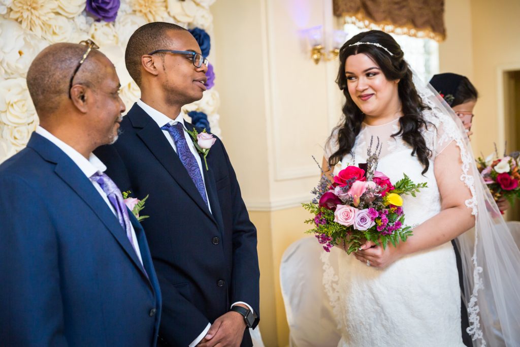 Bride and groom looking at each other during ceremony for an article on wedding photography timeline tips