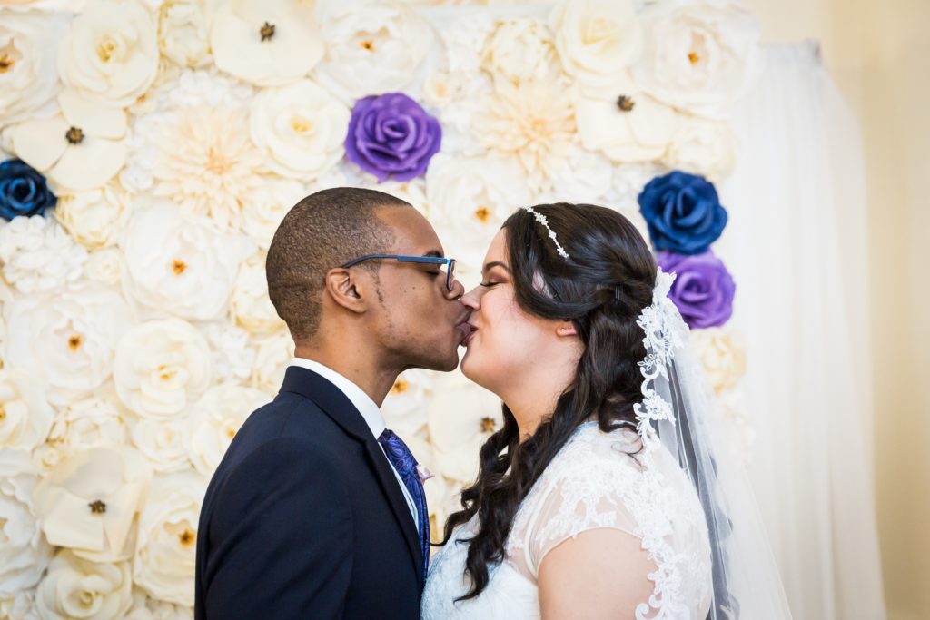 Bride and groom kissing for an article on wedding photography timeline tips