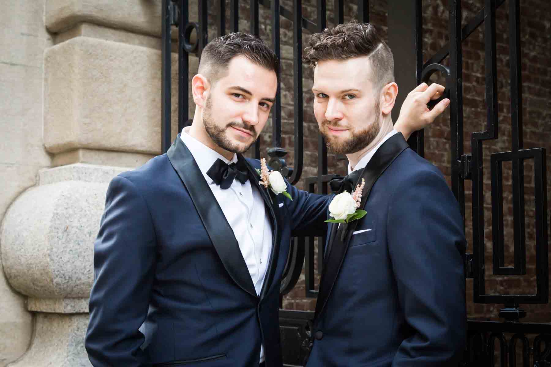 Wedding portraits of two grooms The Dakota apartment building