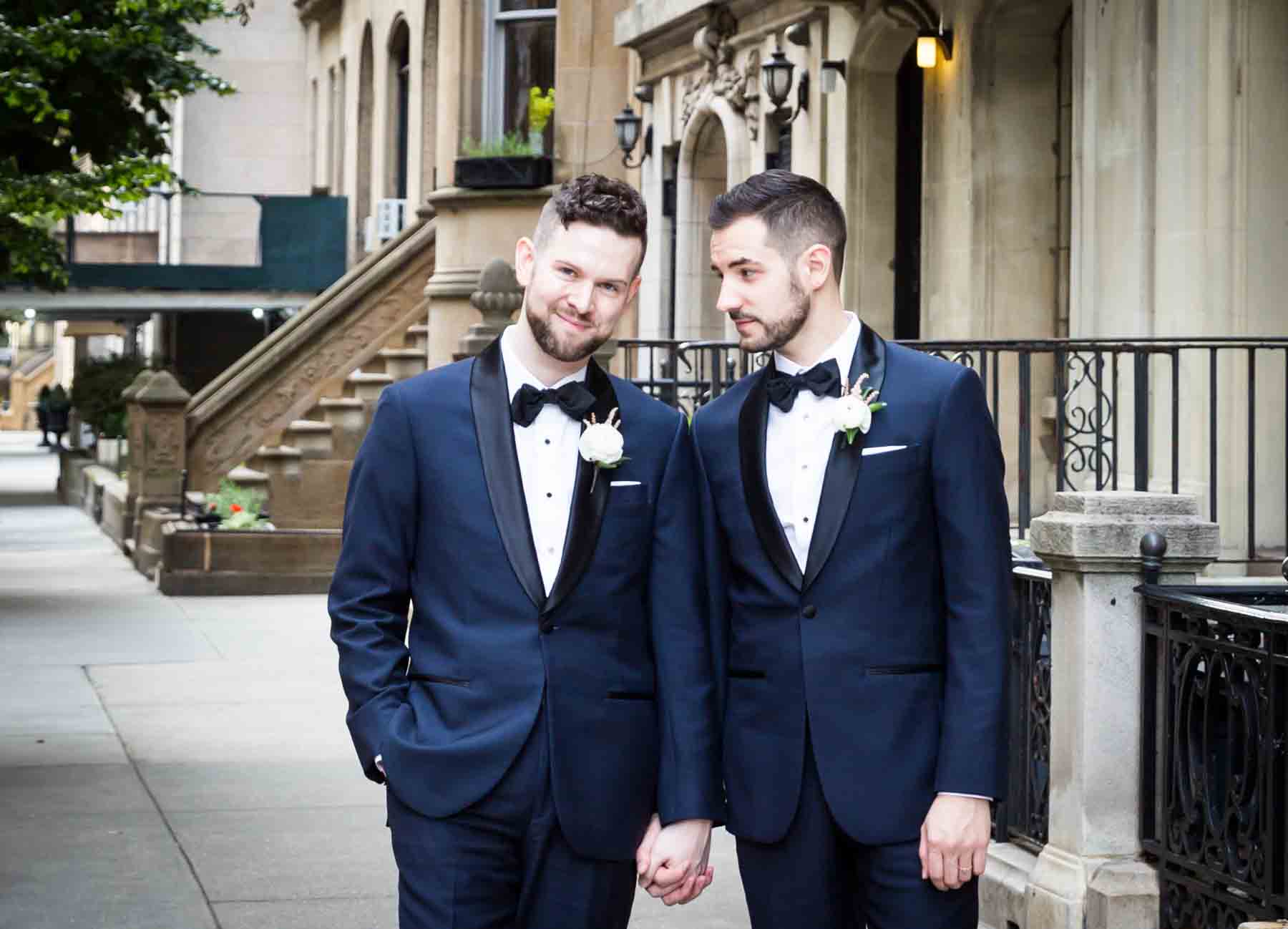 Two grooms on NYC sidewalk for an article entitled, ‘Do you need a permit to get married in Central Park?’