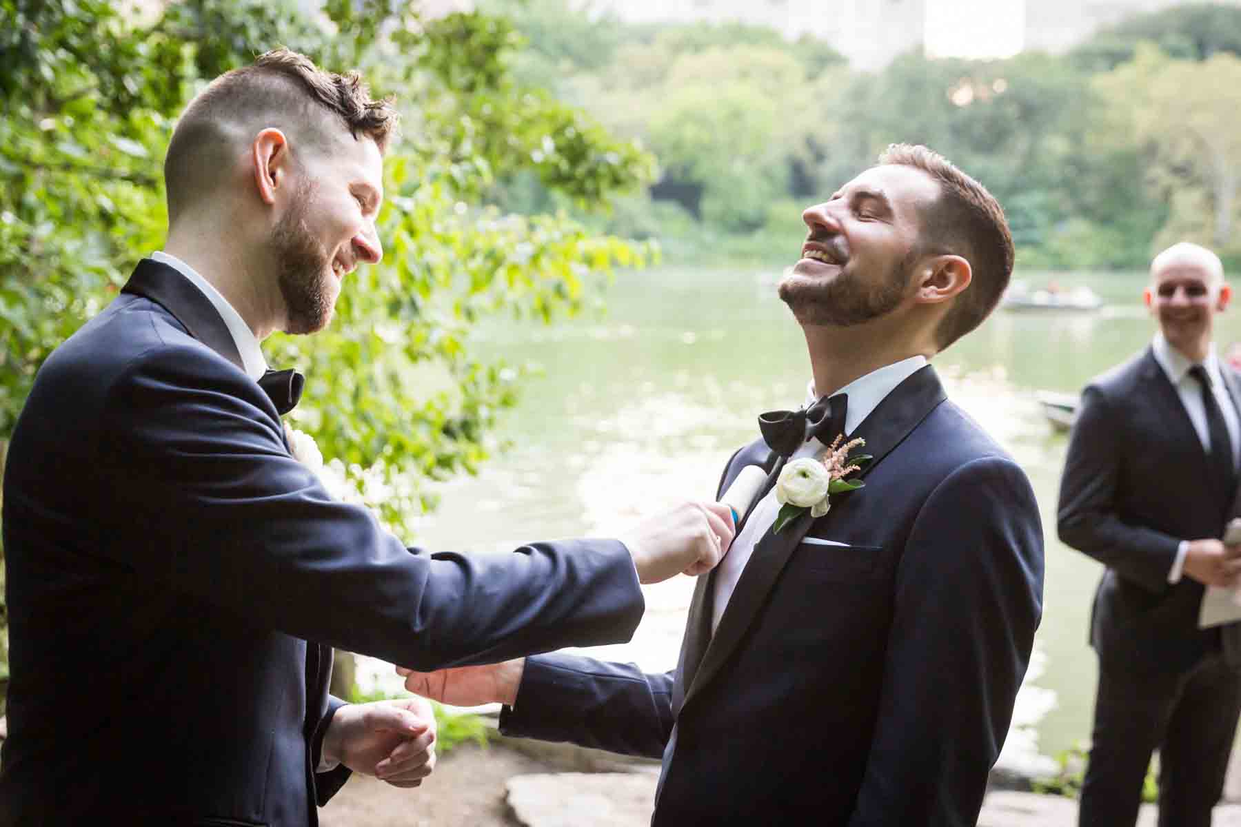 Grooms lint rolling each other for an article entitled, ‘Do you need a permit to get married in Central Park?’