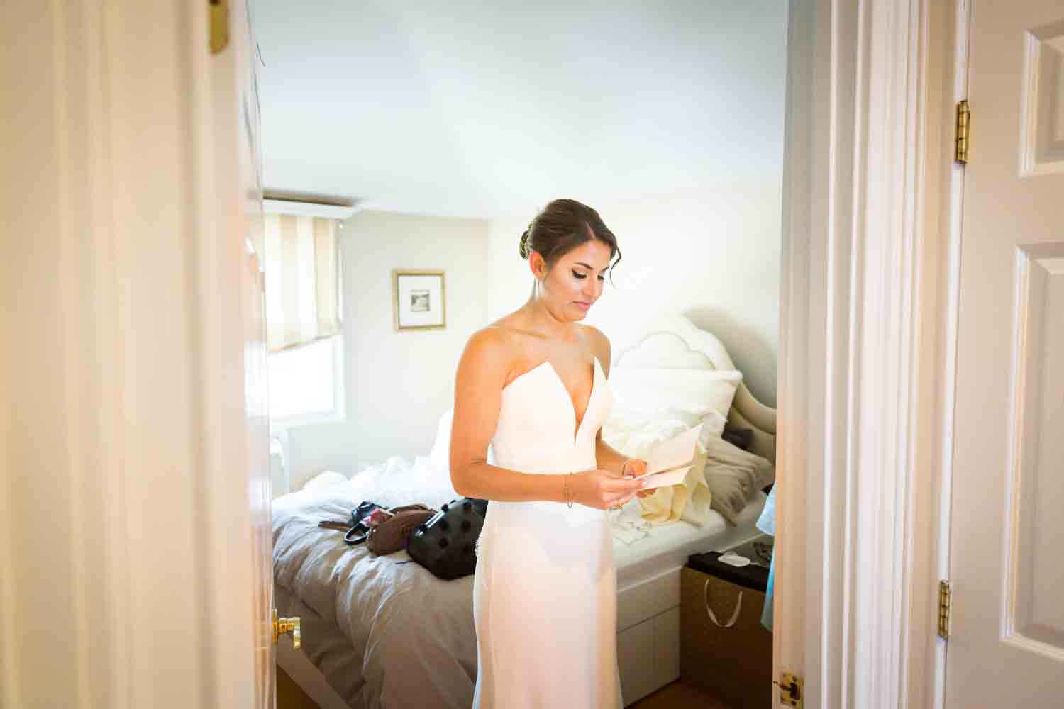 Bride reading groom's letter for an article on Bronx Zoo wedding venue updates
