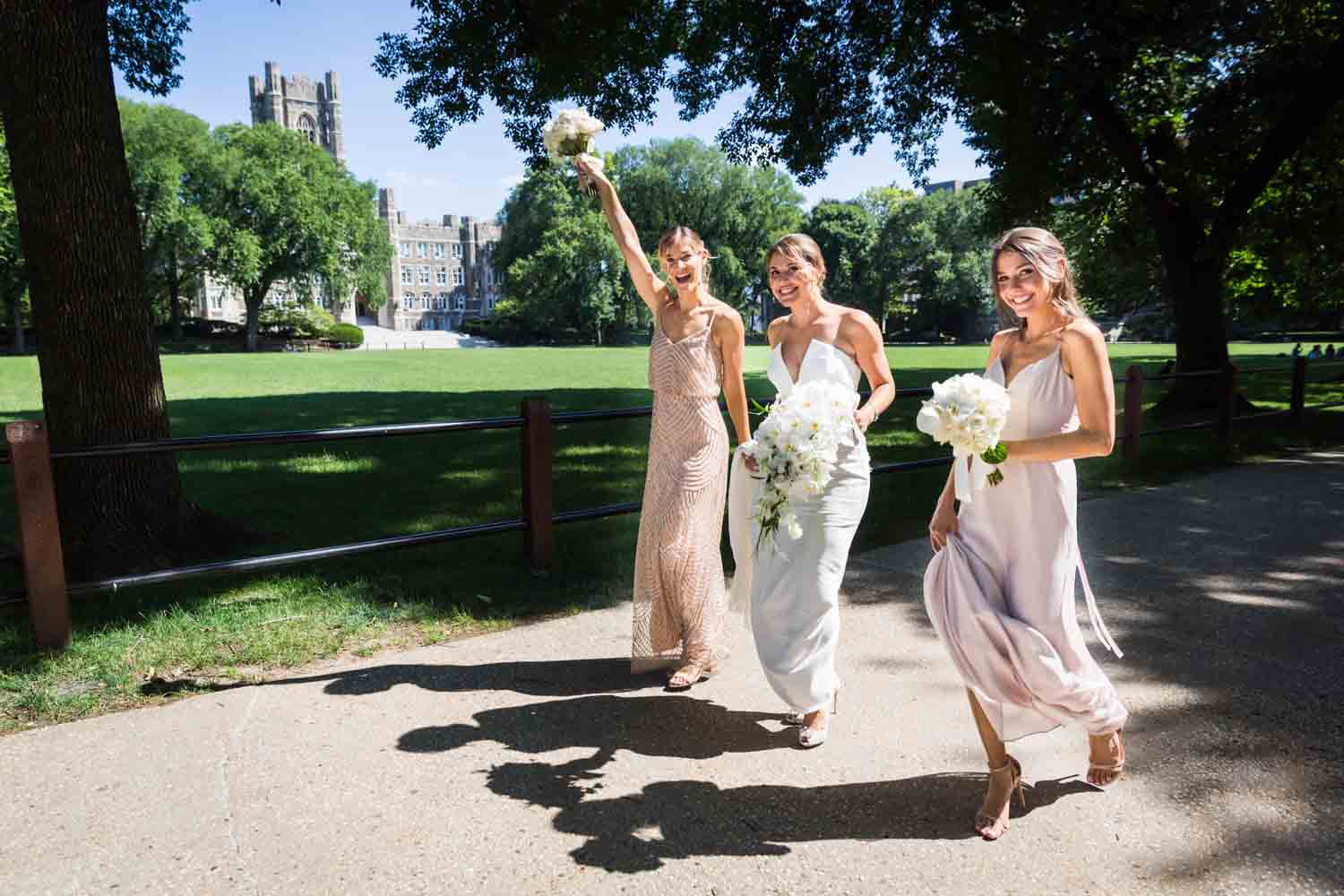 Bride and bridesmaids cheering for an article on Bronx Zoo wedding venue updates