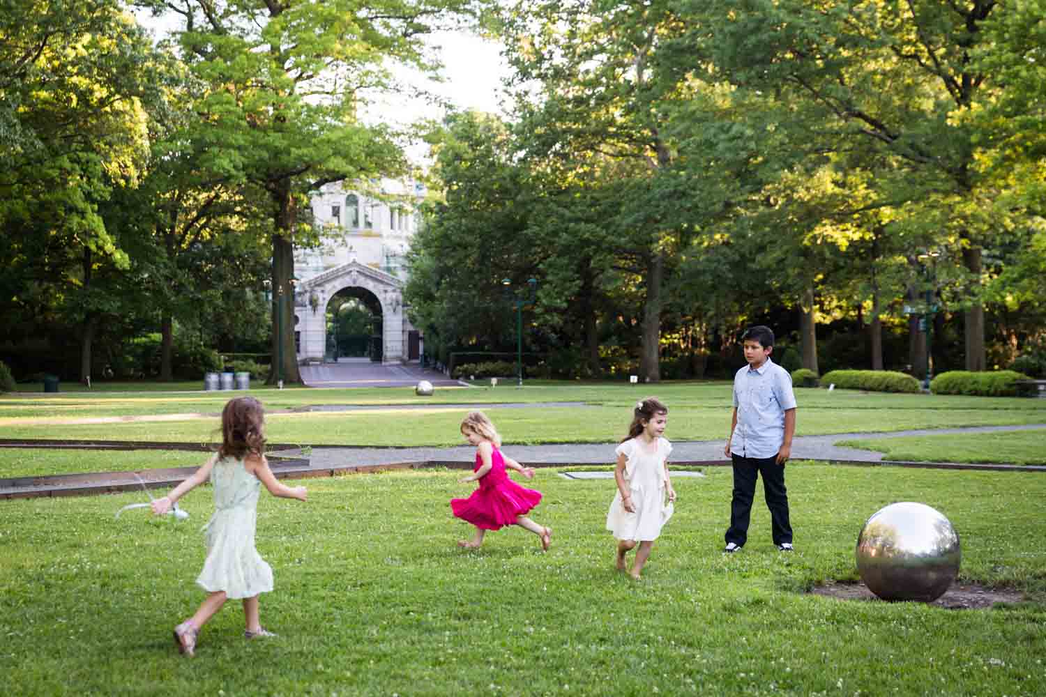 Children playing on Astor Court for an article on Bronx Zoo wedding venue updates