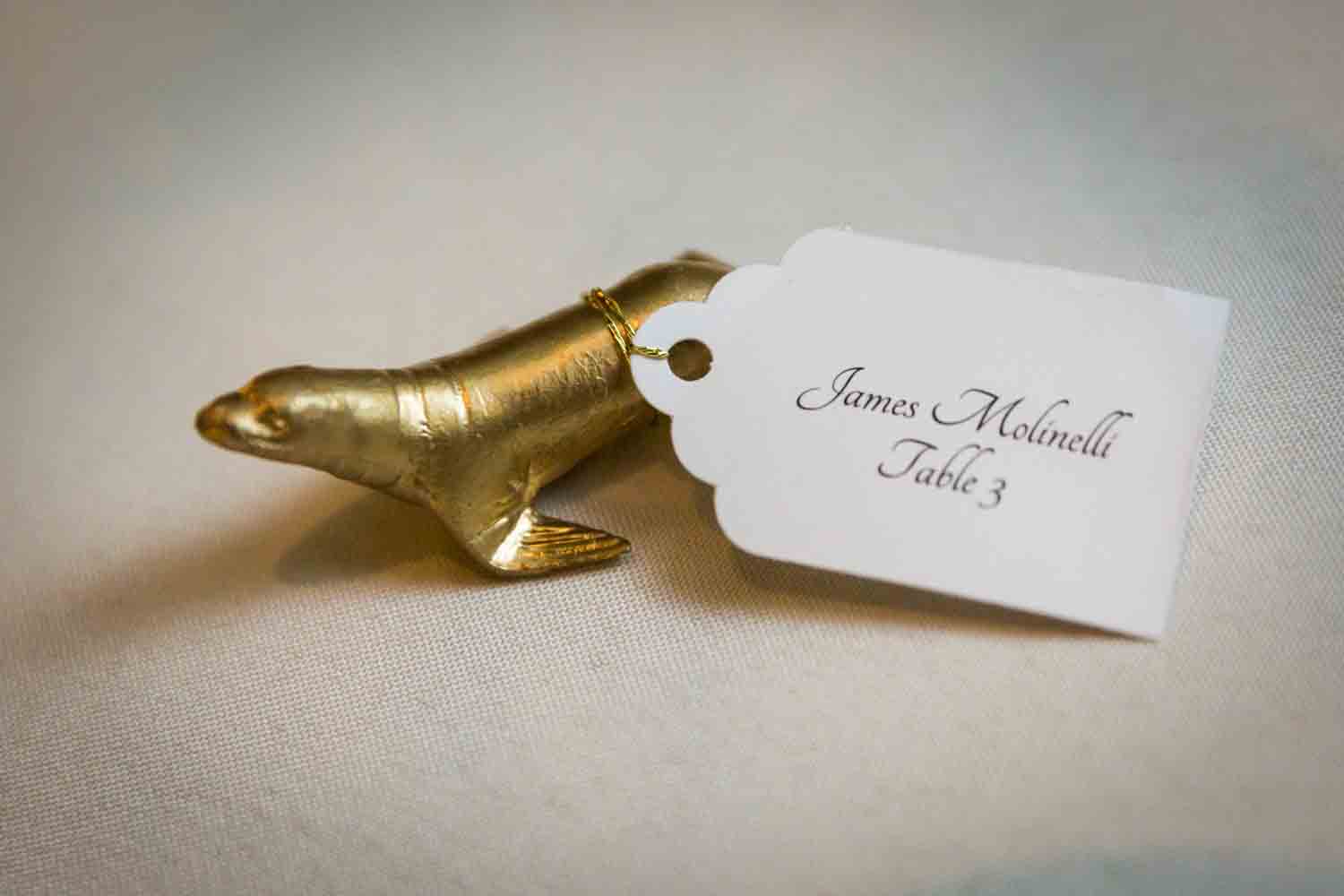 Gold seal escort card for an article on Bronx Zoo wedding venue updates