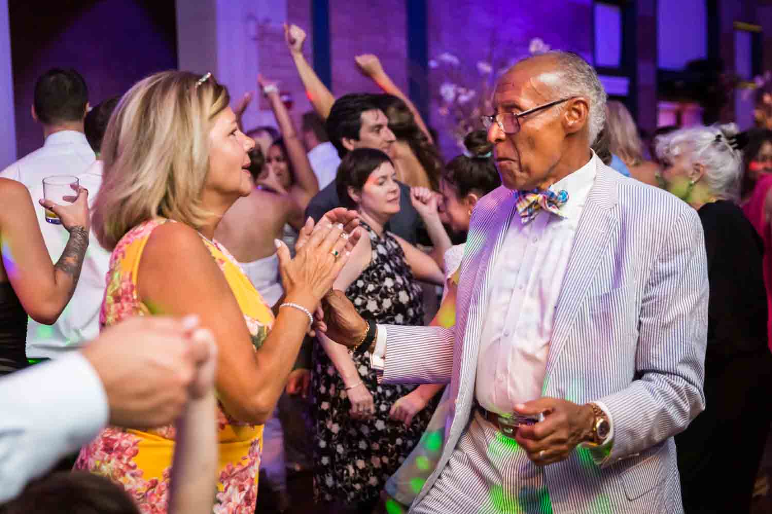 Guests dancing at reception for an article on Bronx Zoo wedding venue updates