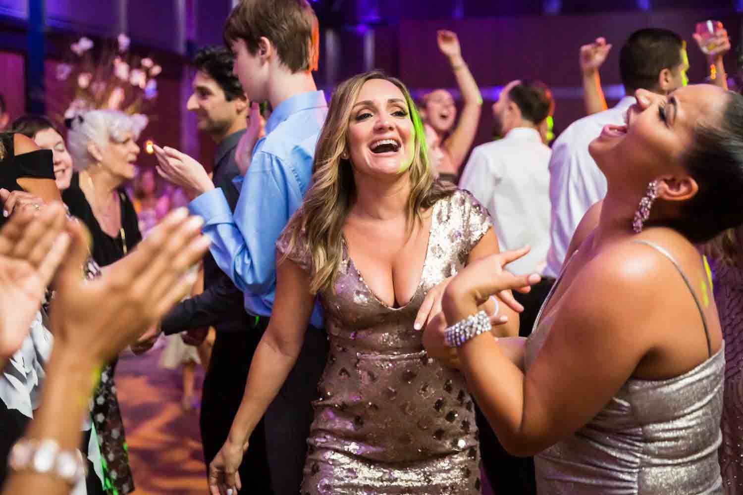 Guests dancing at reception for an article on Bronx Zoo wedding venue updates