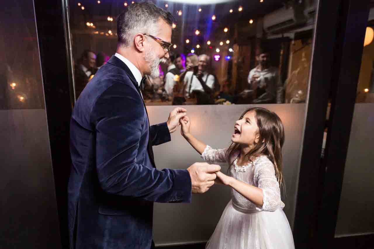 Father dancing with little girl at a Central Park Conservatory Garden wedding
