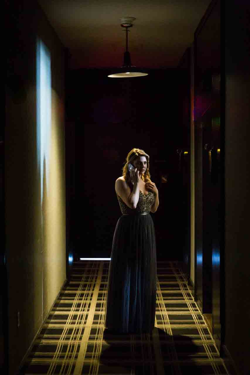 Bridesmaid in a dark hallway at a Central Park Conservatory Garden wedding