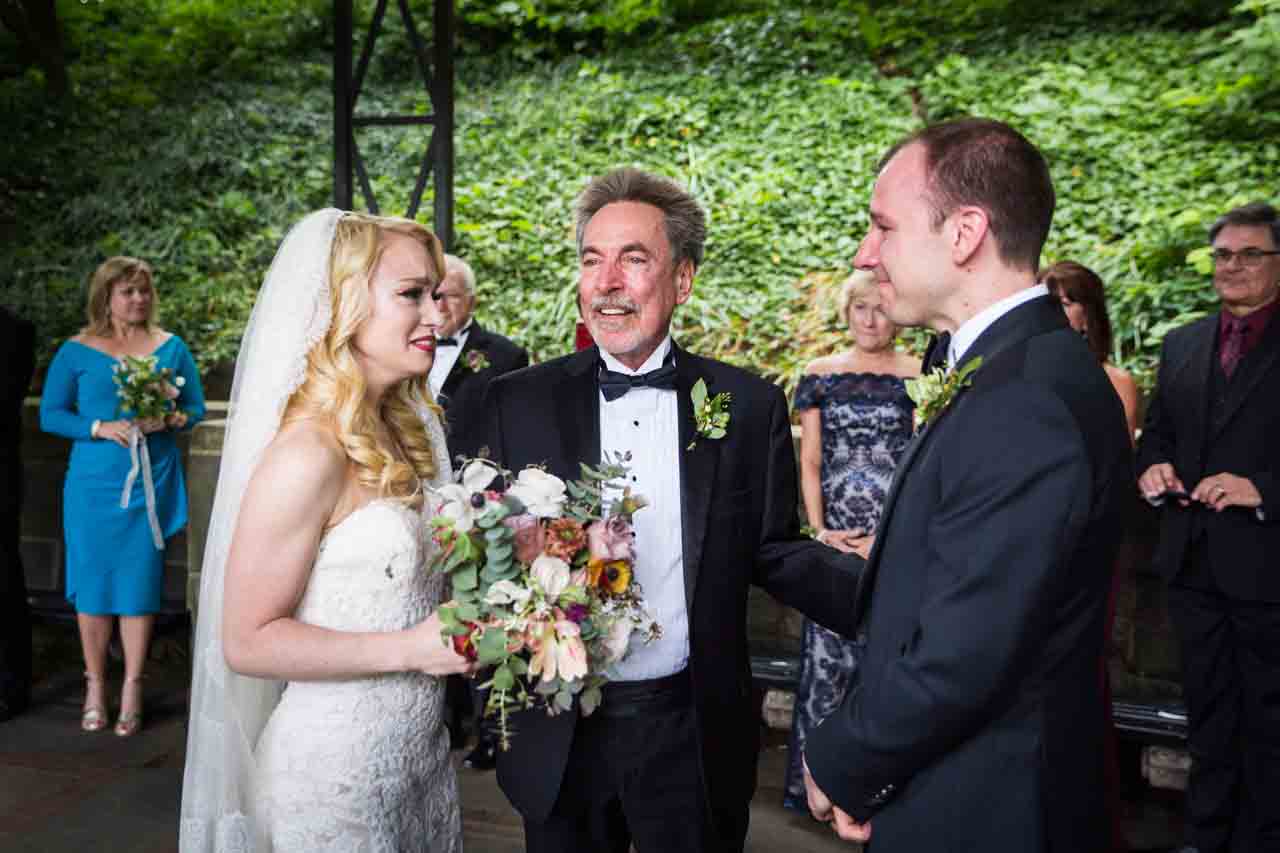 Father giving away bride at a Central Park Conservatory Garden wedding