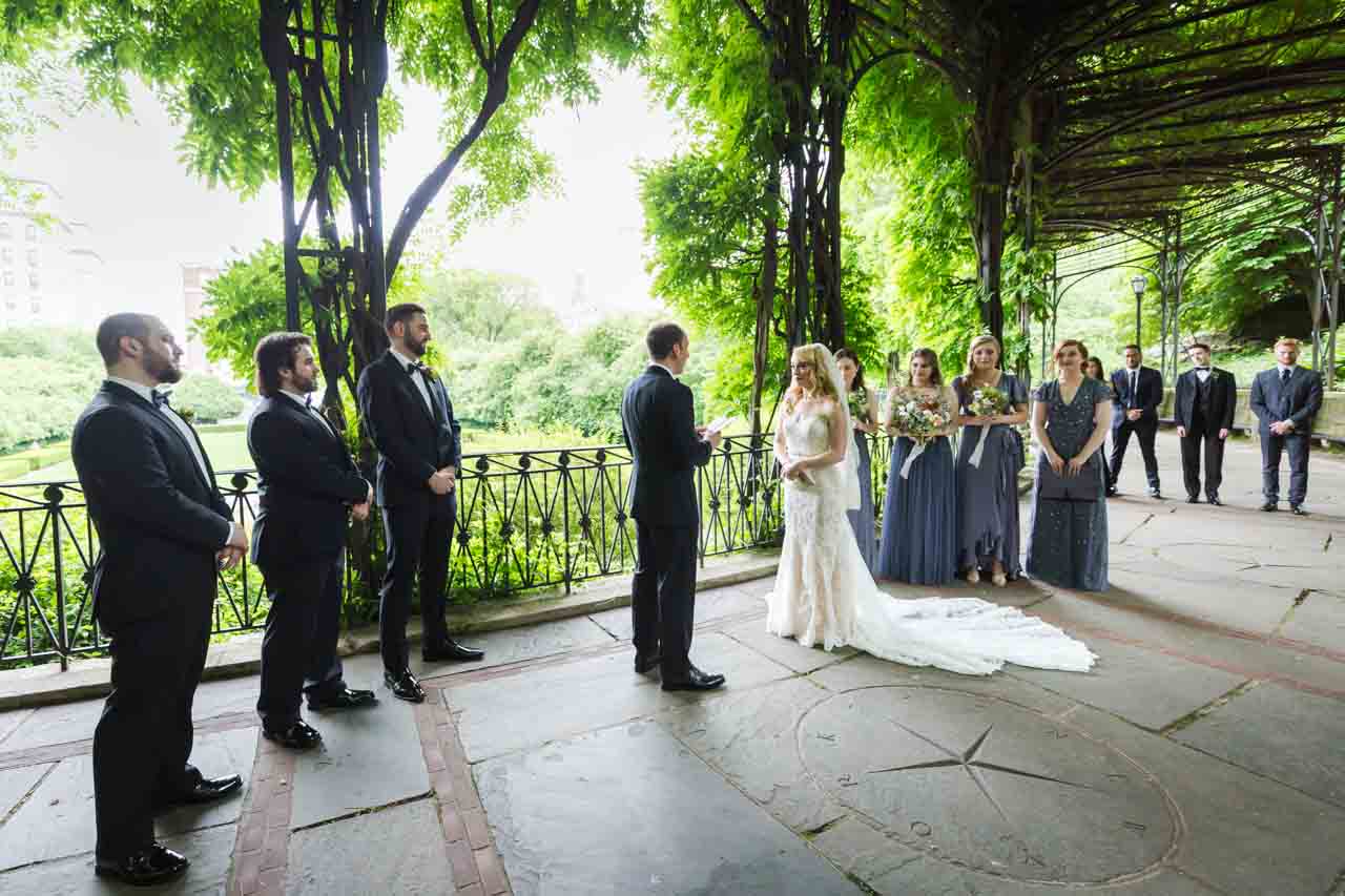 Wisteria pergola ceremony at a Central Park Conservatory Garden wedding 