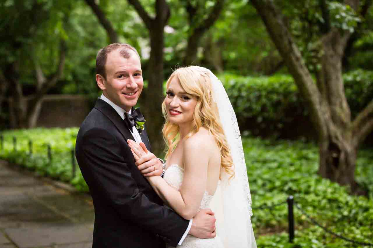 Portrait of bride and groom at a Central Park Conservatory Garden wedding 