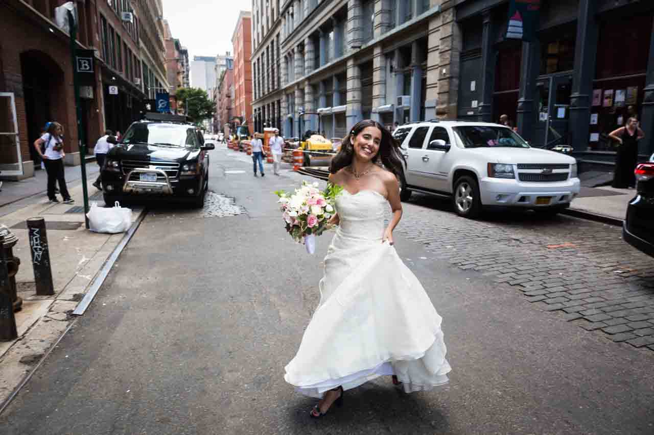 Bride in white dress crossing street for an article on non-floral centerpiece ideas