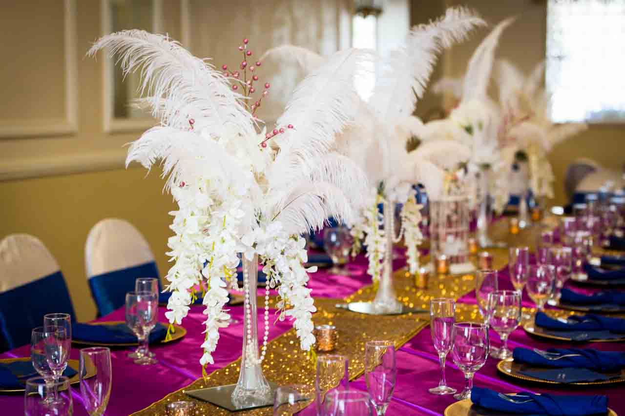 White feather centerpieces for an article on non-floral centerpiece ideas