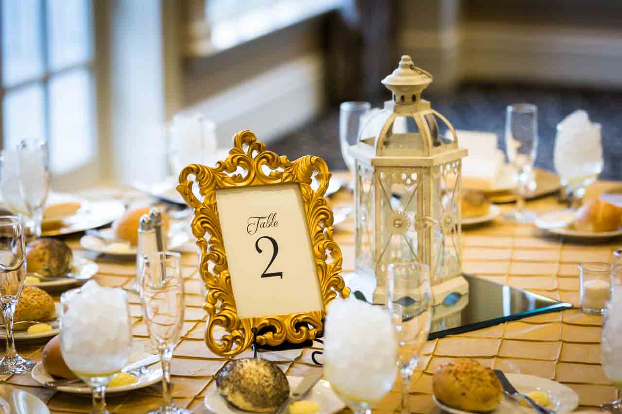 Table setting with lantern and frame for an article on non-floral centerpiece ideas