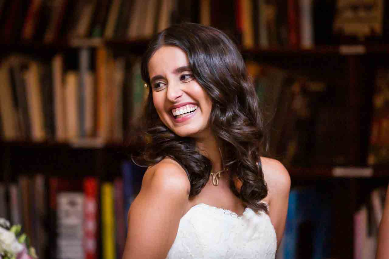 Bride laughing during ceremony for an article on non-floral centerpiece ideas