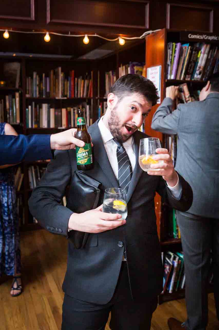 Guest enjoying drinks at reception for an article on non-floral centerpiece ideas