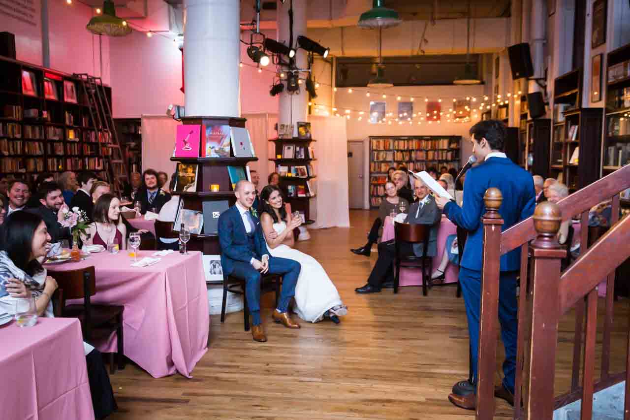 Bride and groom listening to speech for an article on non-floral centerpiece ideas