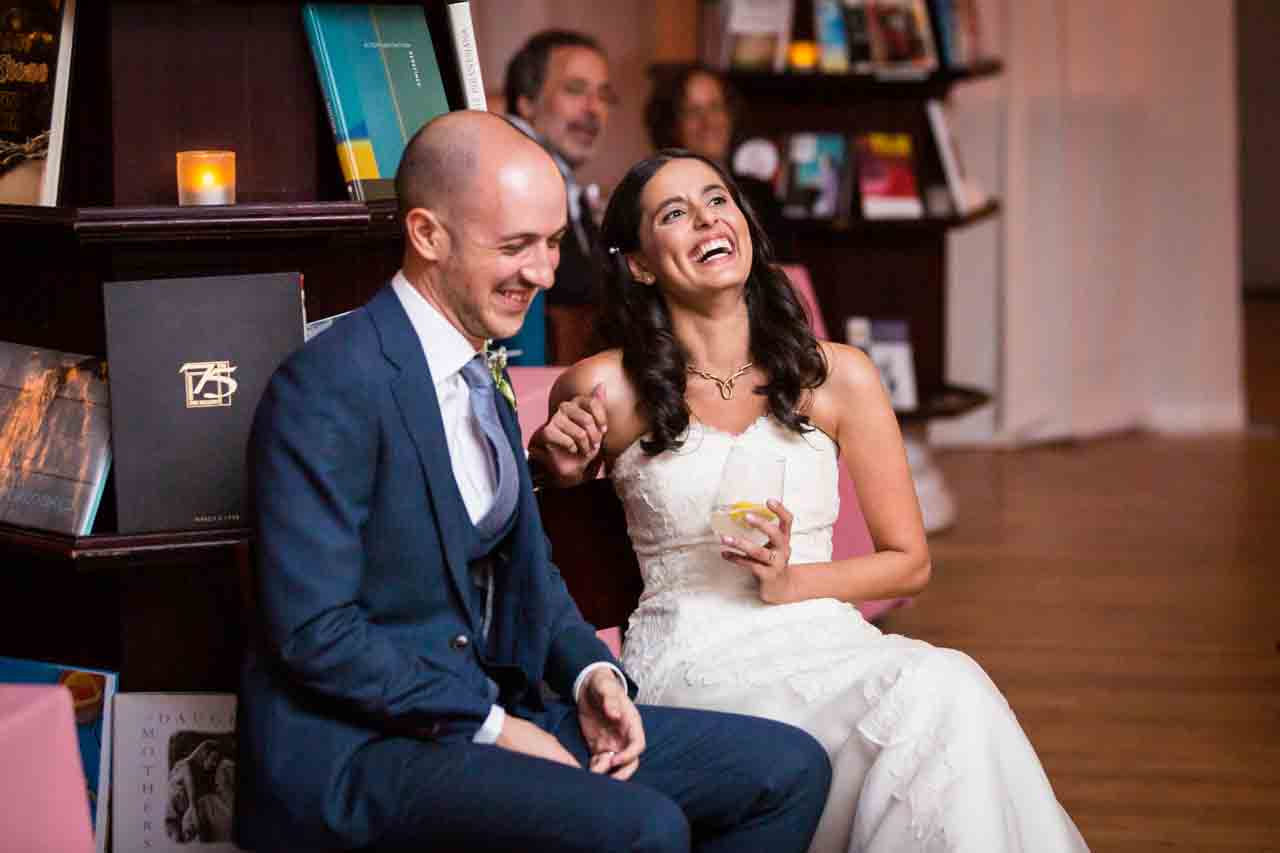 Bride and groom laughing at toasts for an article on non-floral centerpiece ideas