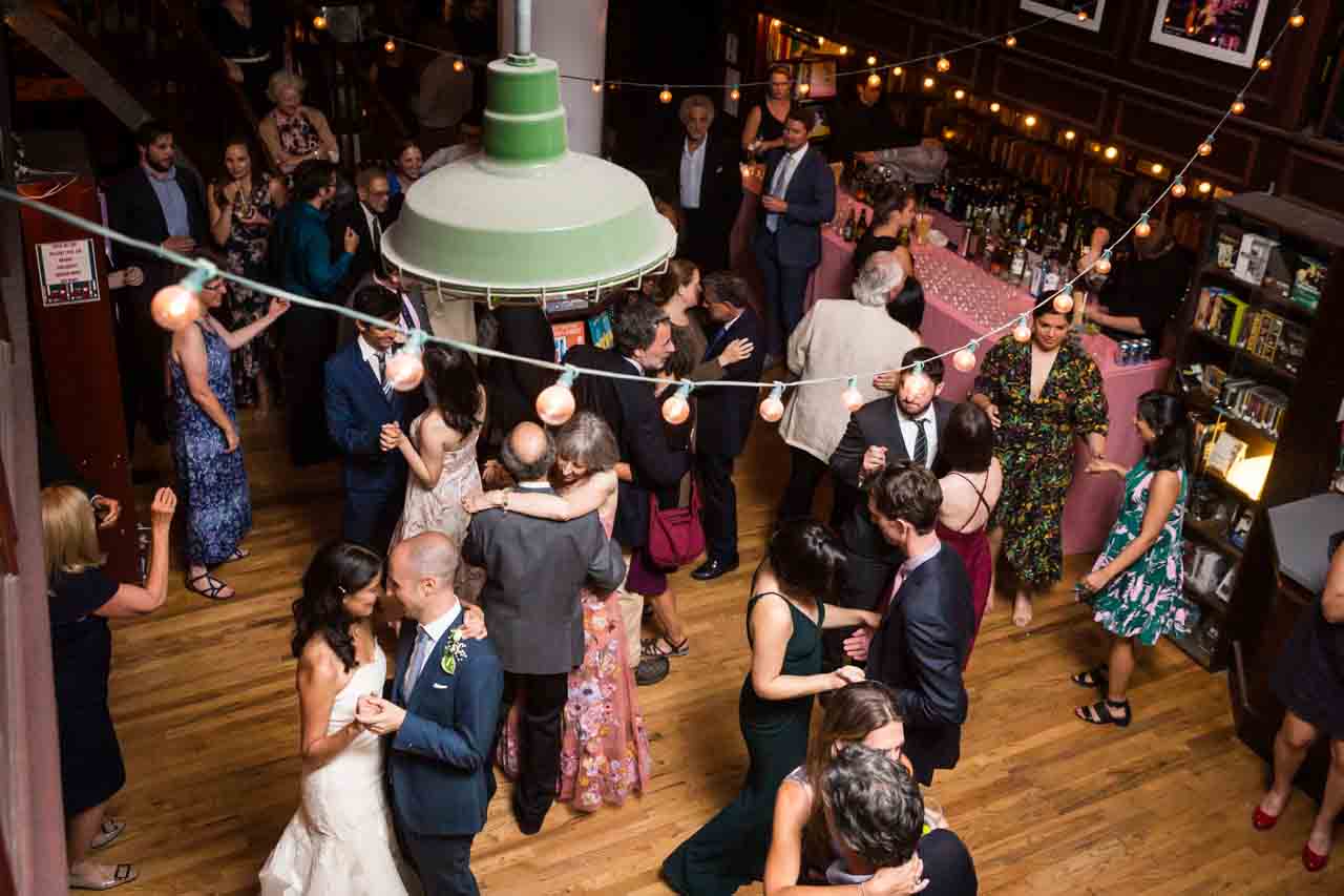 Guests dancing at wedding reception for an article on non-floral centerpiece ideas