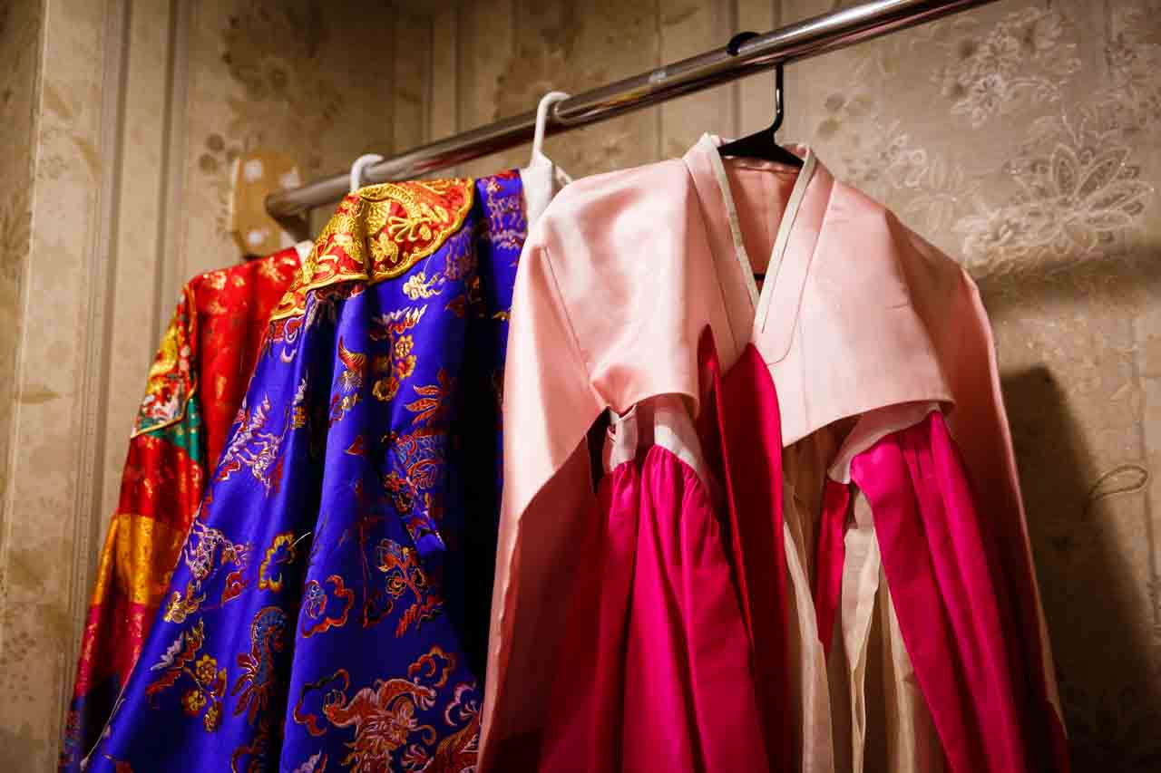 Hanbok hanging in closet at traditional Korean pyebaek ceremony