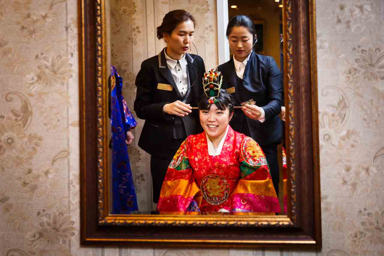 Bride and two attendants during traditional Korean pyebaek ceremony
