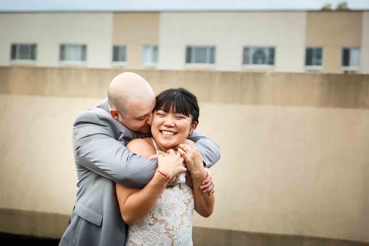 Groom hugging bride after traditional Korean pyebaek ceremony