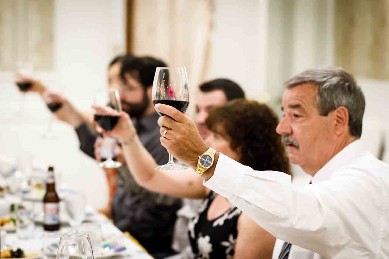 Guests making a toast after traditional Korean pyebaek ceremony