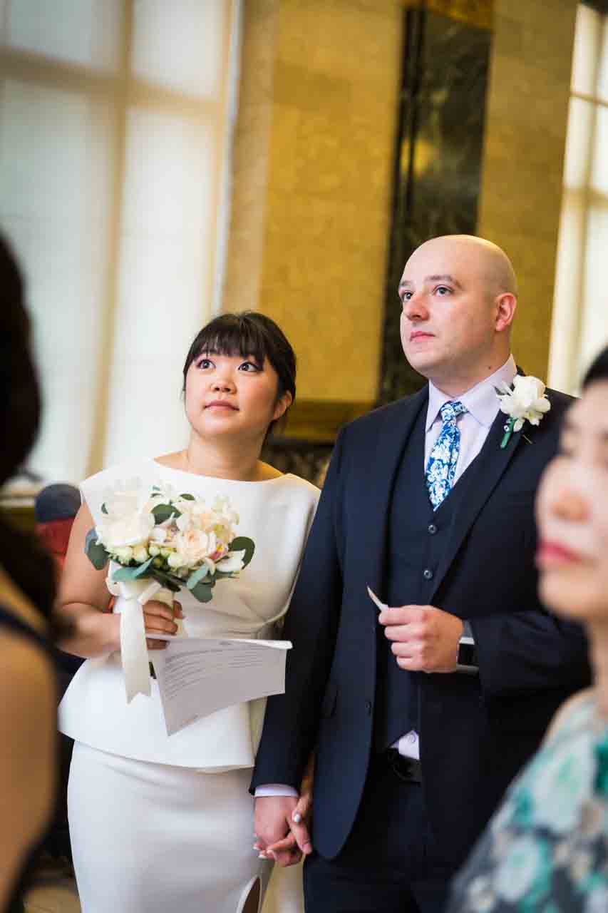 Bride and groom waiting for number to be called