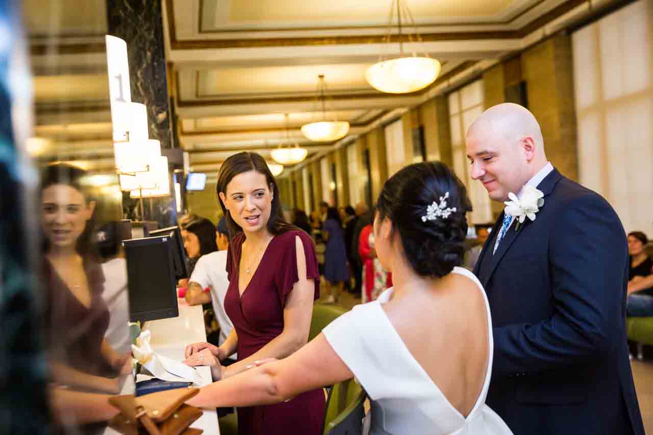 Witness with bride and groom at City Clerk's Office