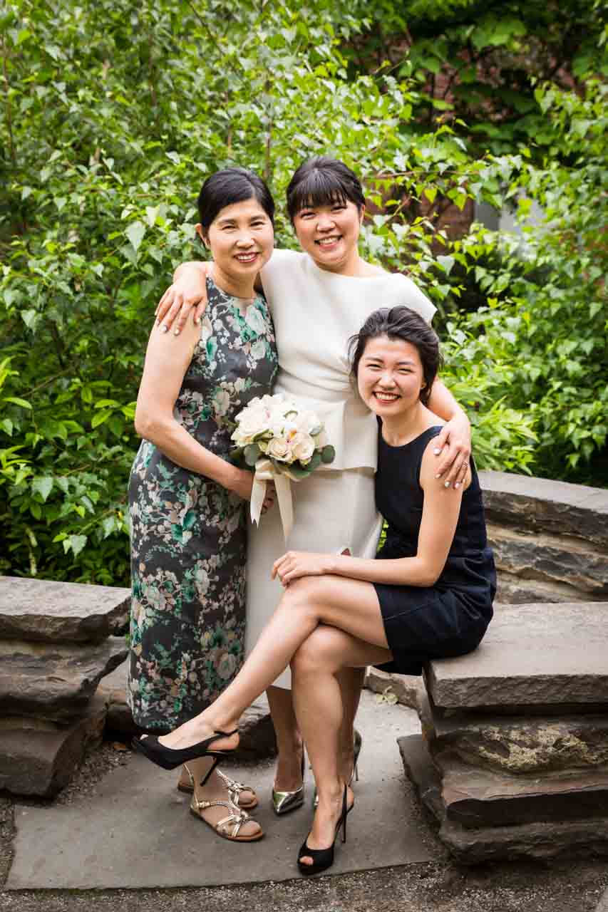 Bride, mother, and sister in Brooklyn Bridge Park