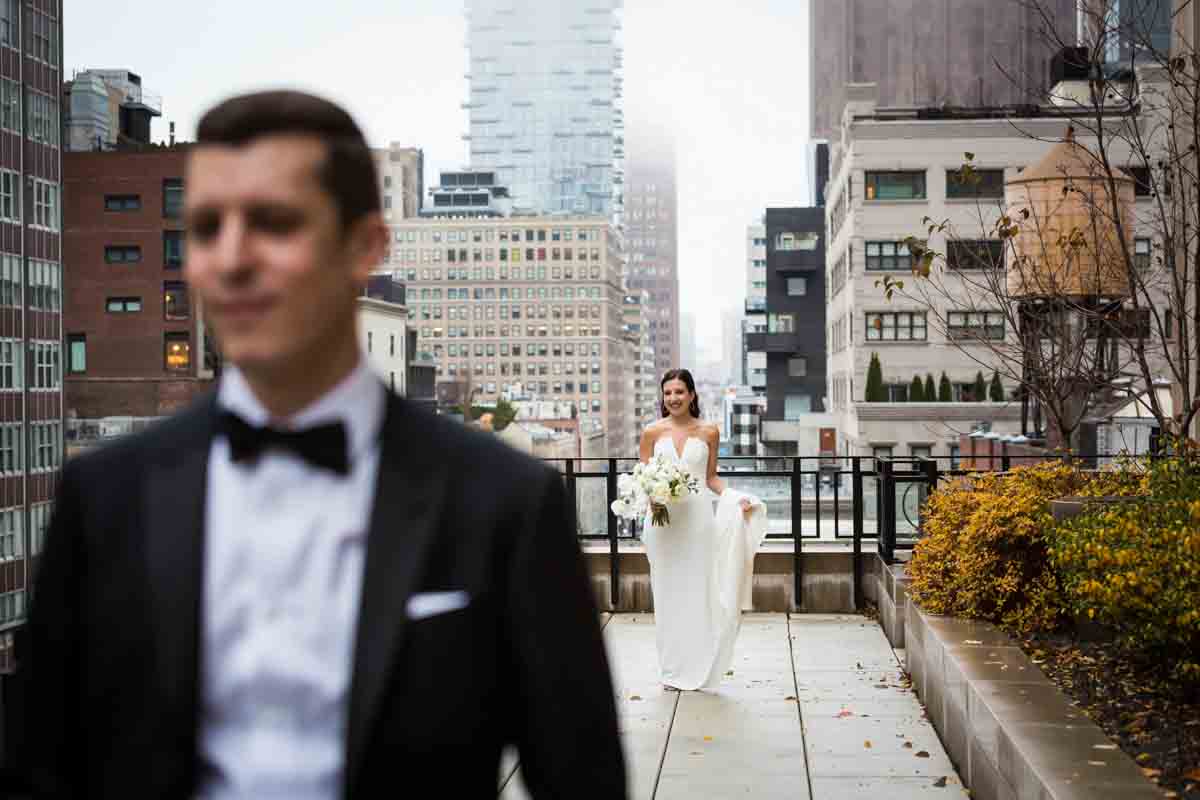 Bride looking at groom before first look at the Four Seasons Hotel New York Downtown