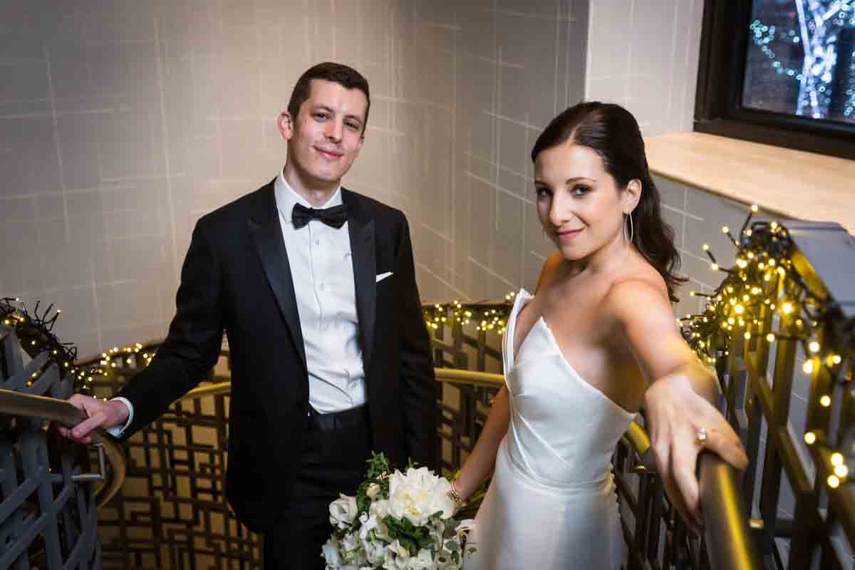 Bride and groom looking fierce on a staircase