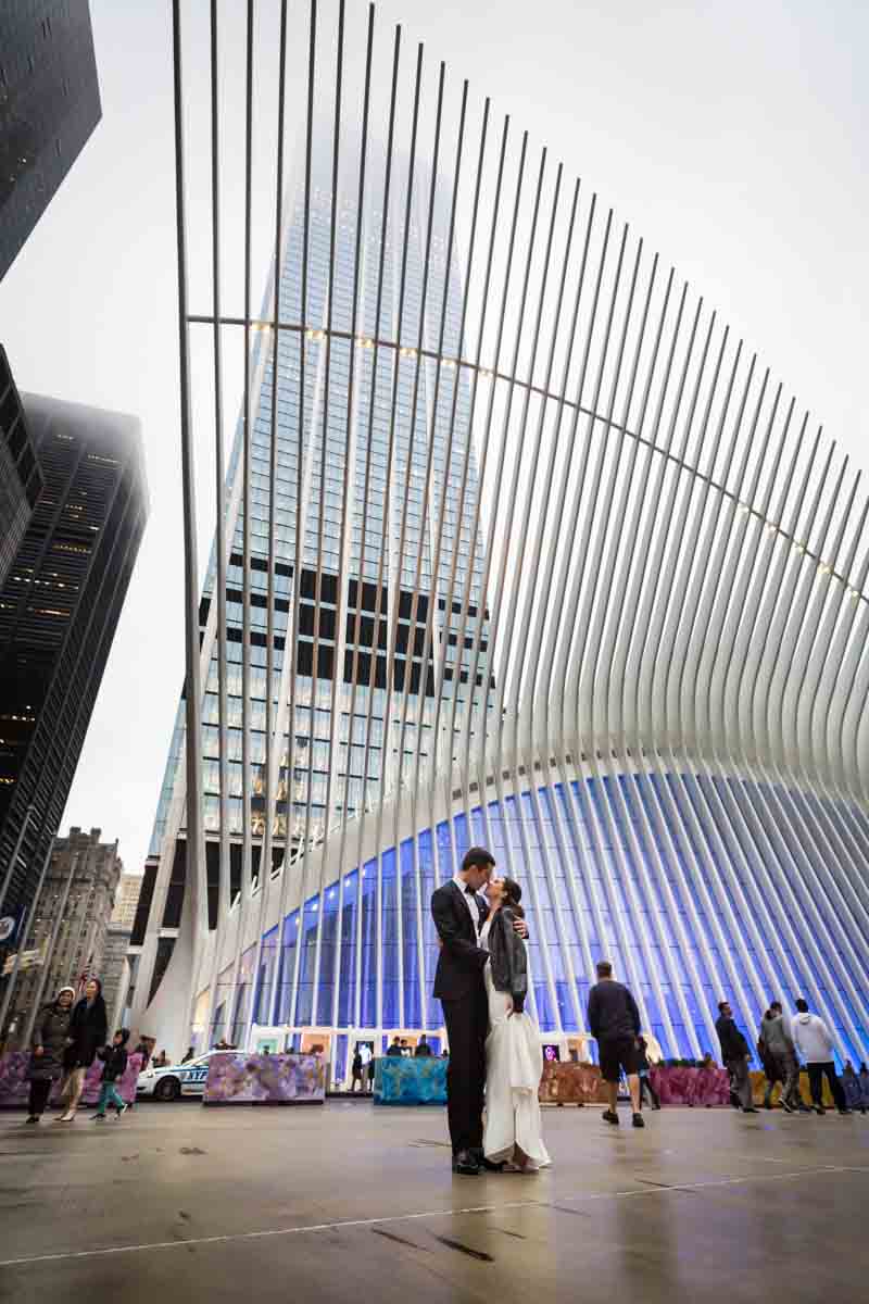 Bride and groom posed in front of Oculus in NYC