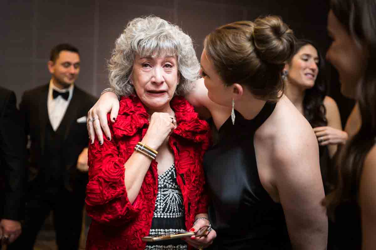 Mother crying after ketubah signing at a Four Seasons Hotel New York Downtown wedding