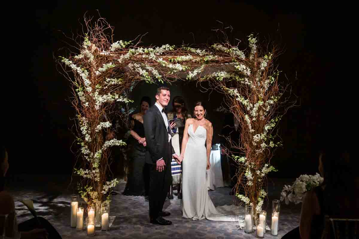 Bride and groom during a Four Seasons Hotel New York Downtown wedding ceremony