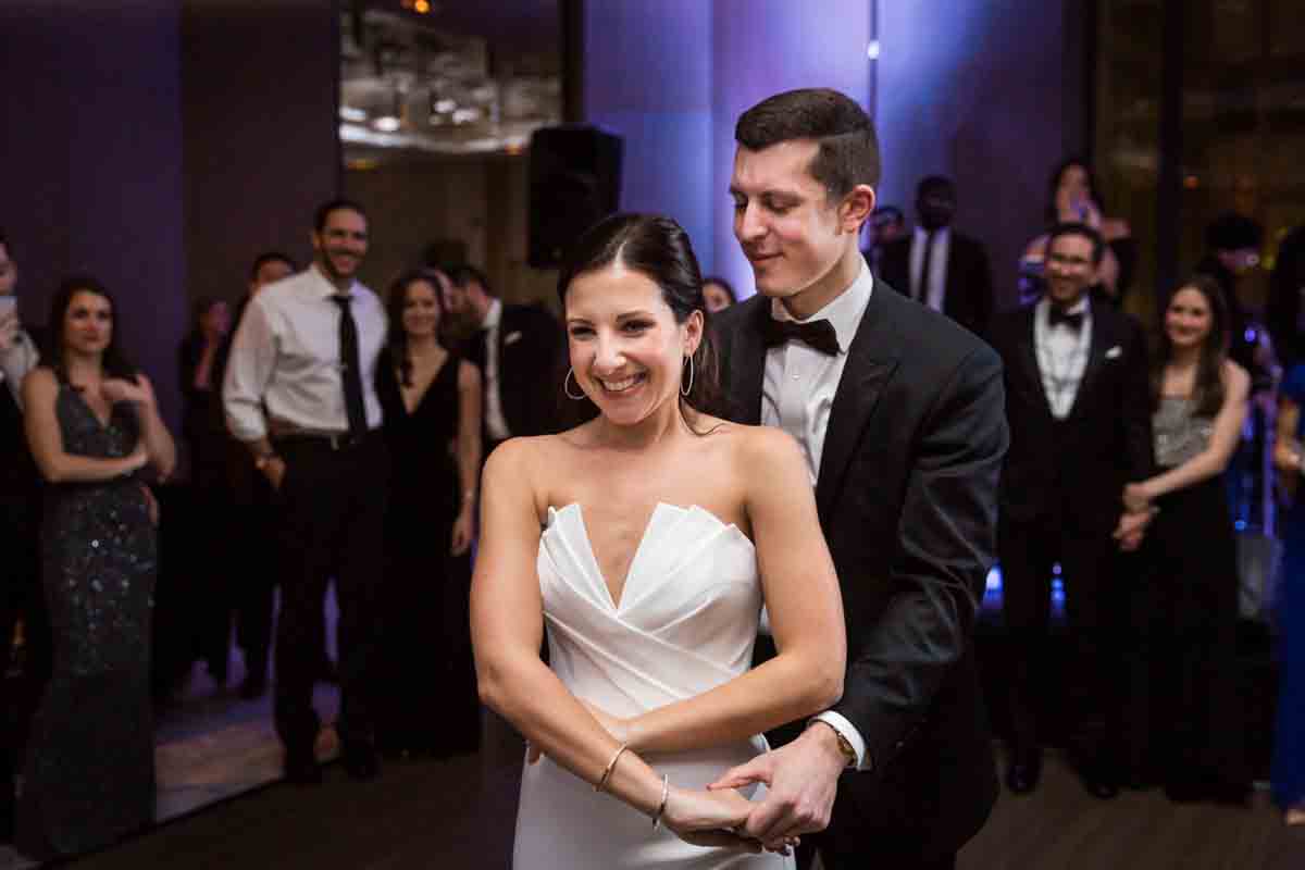 Groom looking at bride during first dance at a Four Seasons Hotel New York Downtown wedding