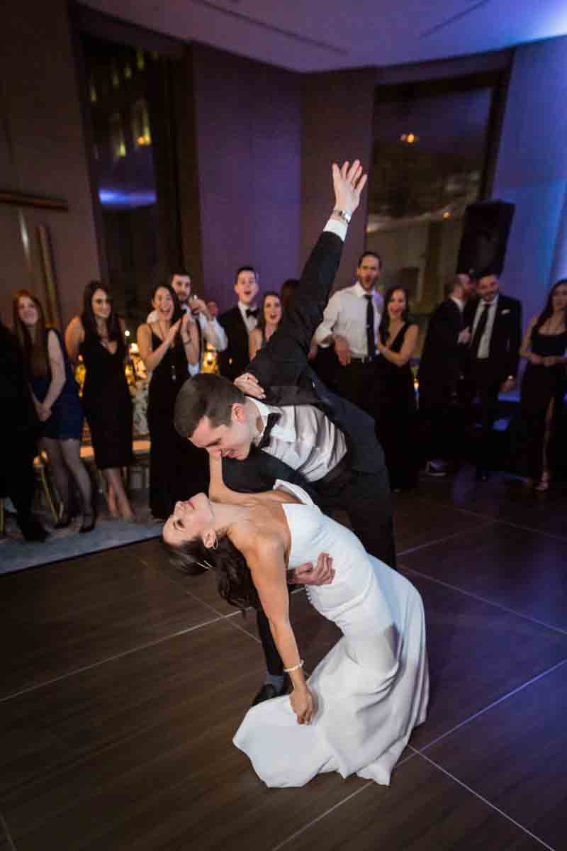 Groom dipping bride during first dance at a Four Seasons Hotel New York Downtown wedding
