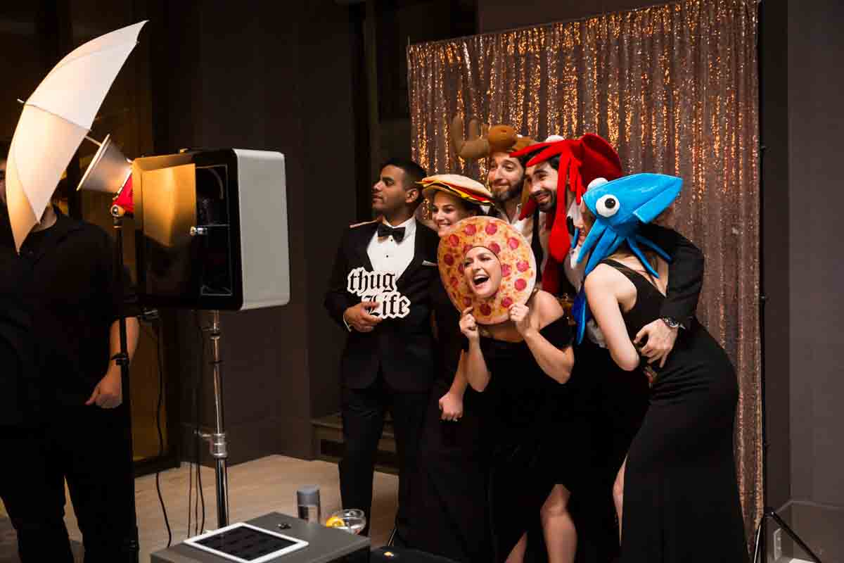 Guests clowning around at photo booth during Four Seasons Hotel New York Downtown wedding