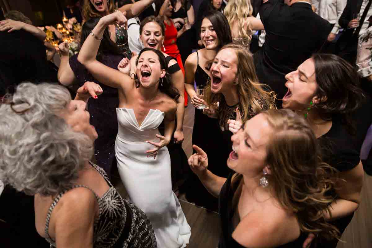 Bride dancing with guests at Four Seasons Hotel New York Downtown wedding reception