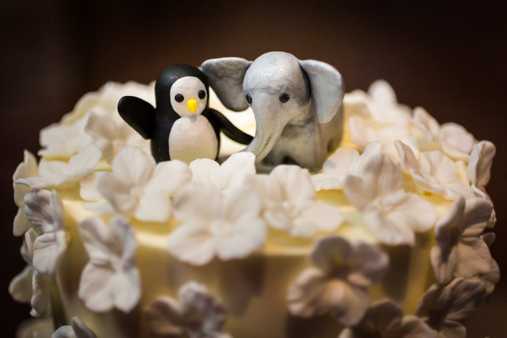 Penguin and elephant wedding cake toppers at Bronx Zoo wedding