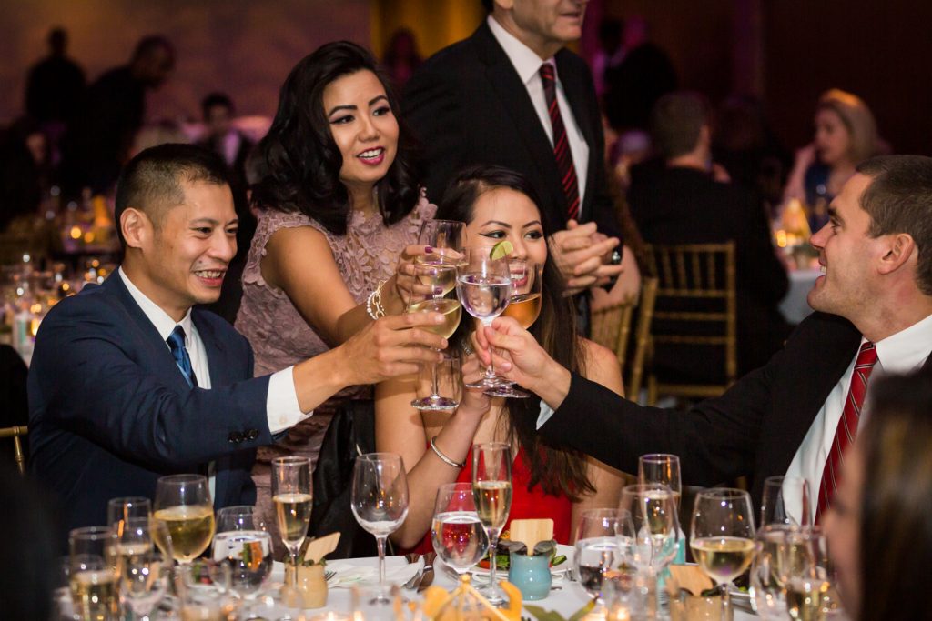 Guests toasting with glasses at Bronx Zoo wedding