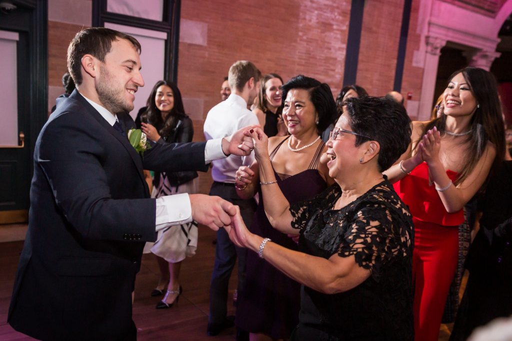 Groom dancing with mother-in-law at Bronx Zoo wedding reception