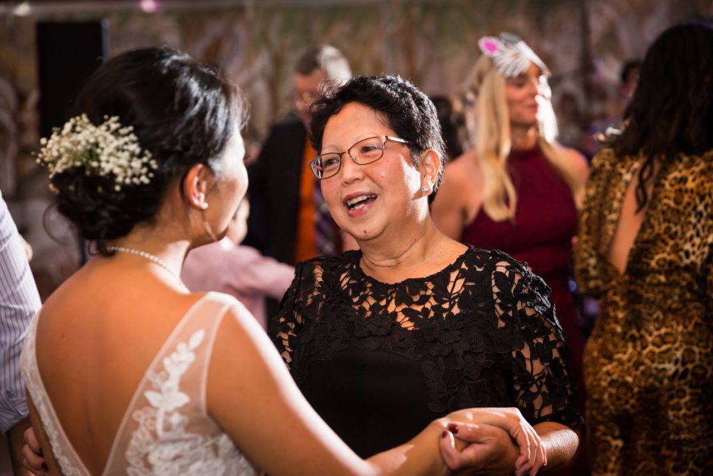 Woman greeting bride at Bronx Zoo wedding