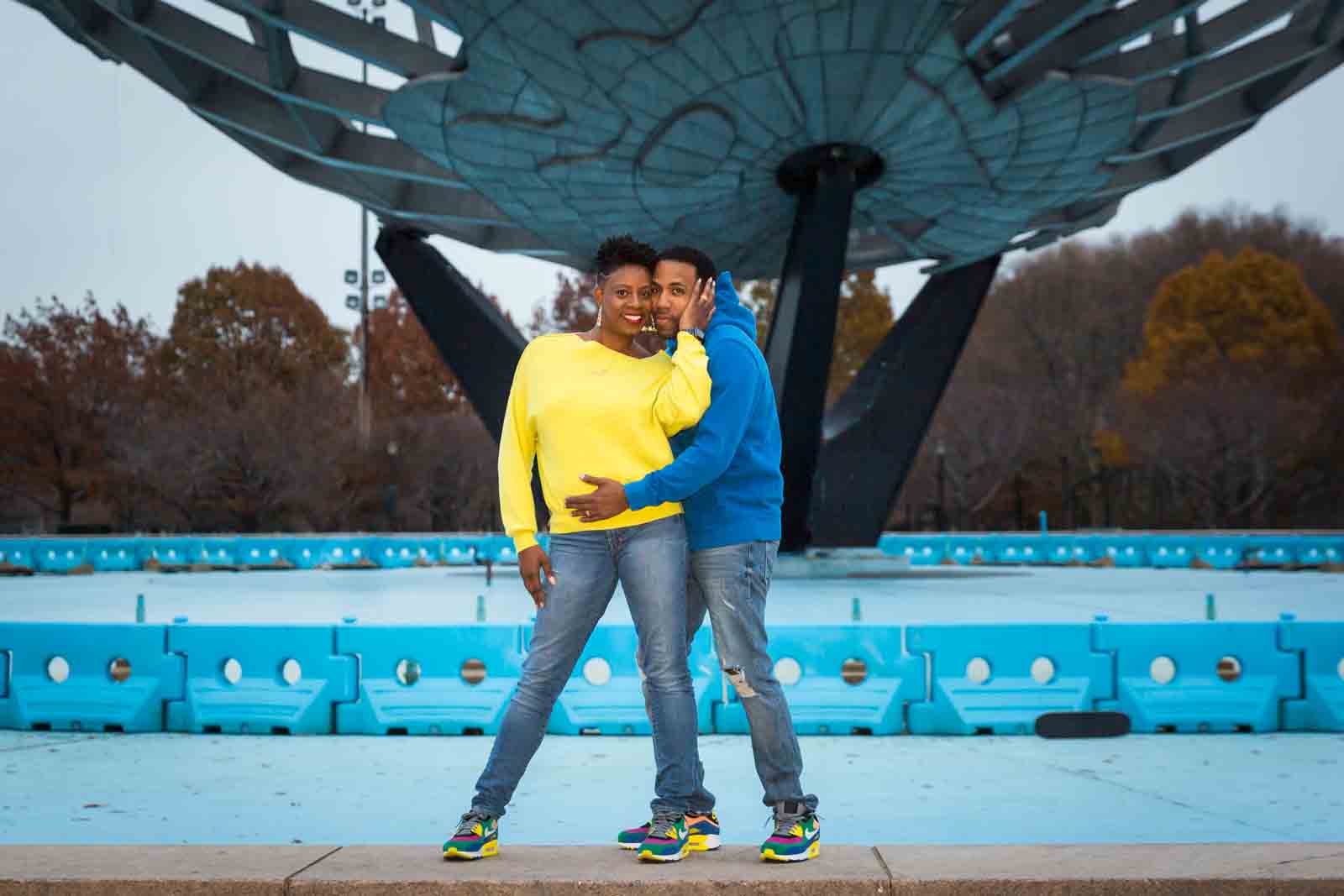 Flushing Meadows Corona Park family portraits of parents alone in front of Unisphere