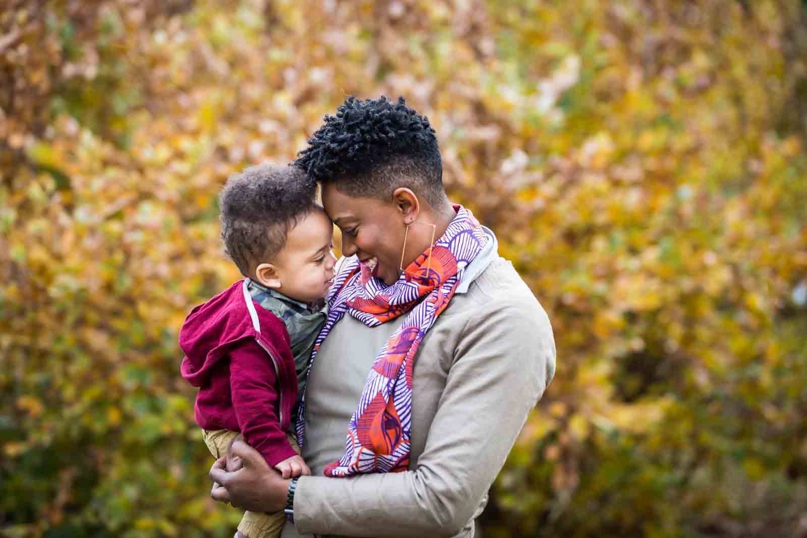 Flushing Meadows Corona Park family portrait of mother and little boy touching foreheads