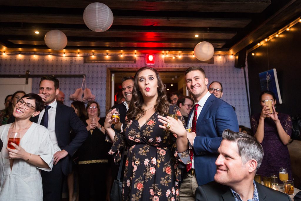 Woman making funny face at wedding reception