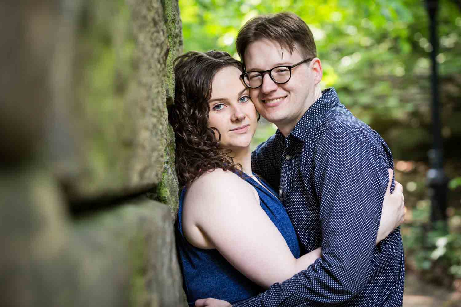 Couple underneath the Ramble Stone Arch in Shakespeare Garden engagement photos