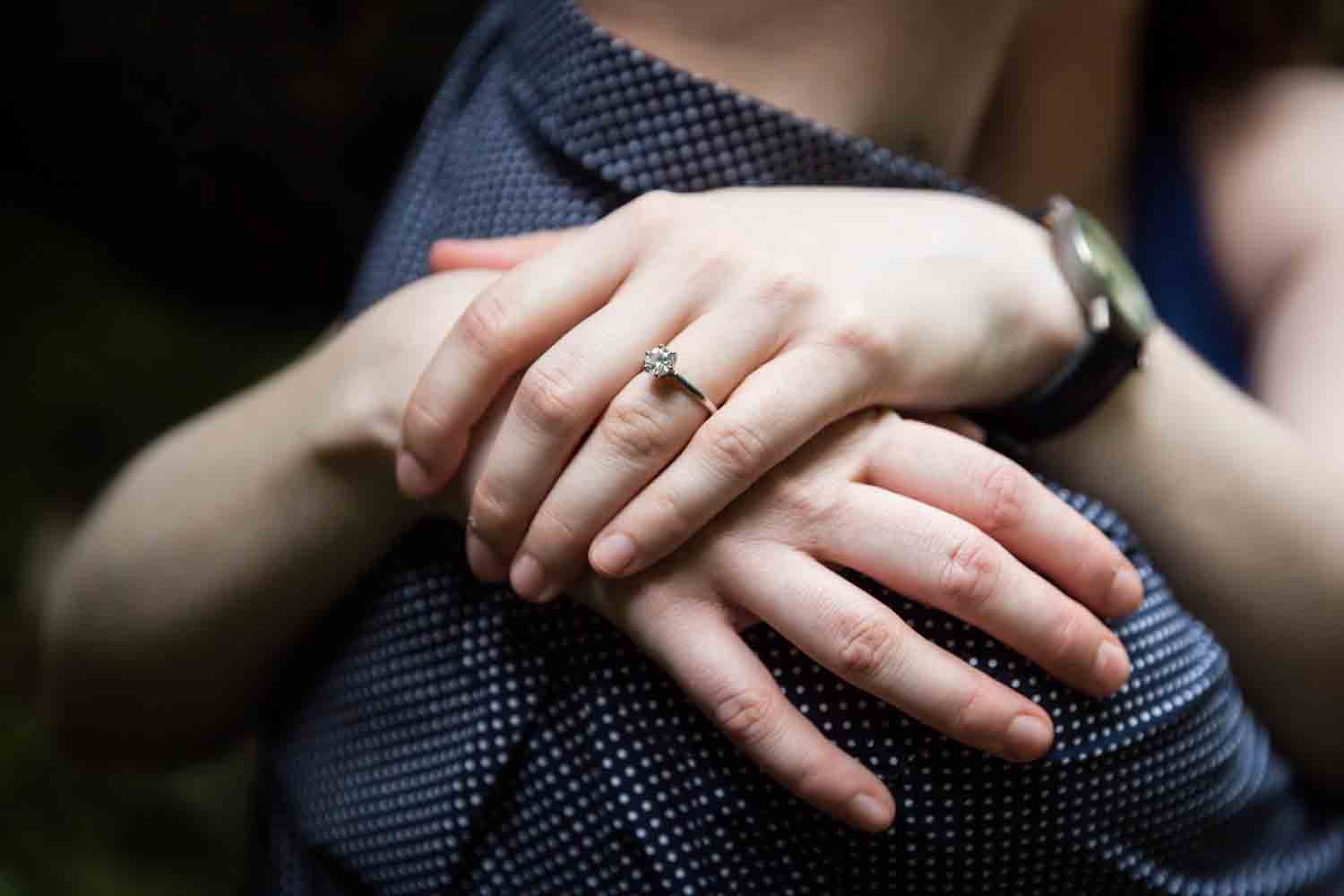 Close up of engagement ring on woman's hand