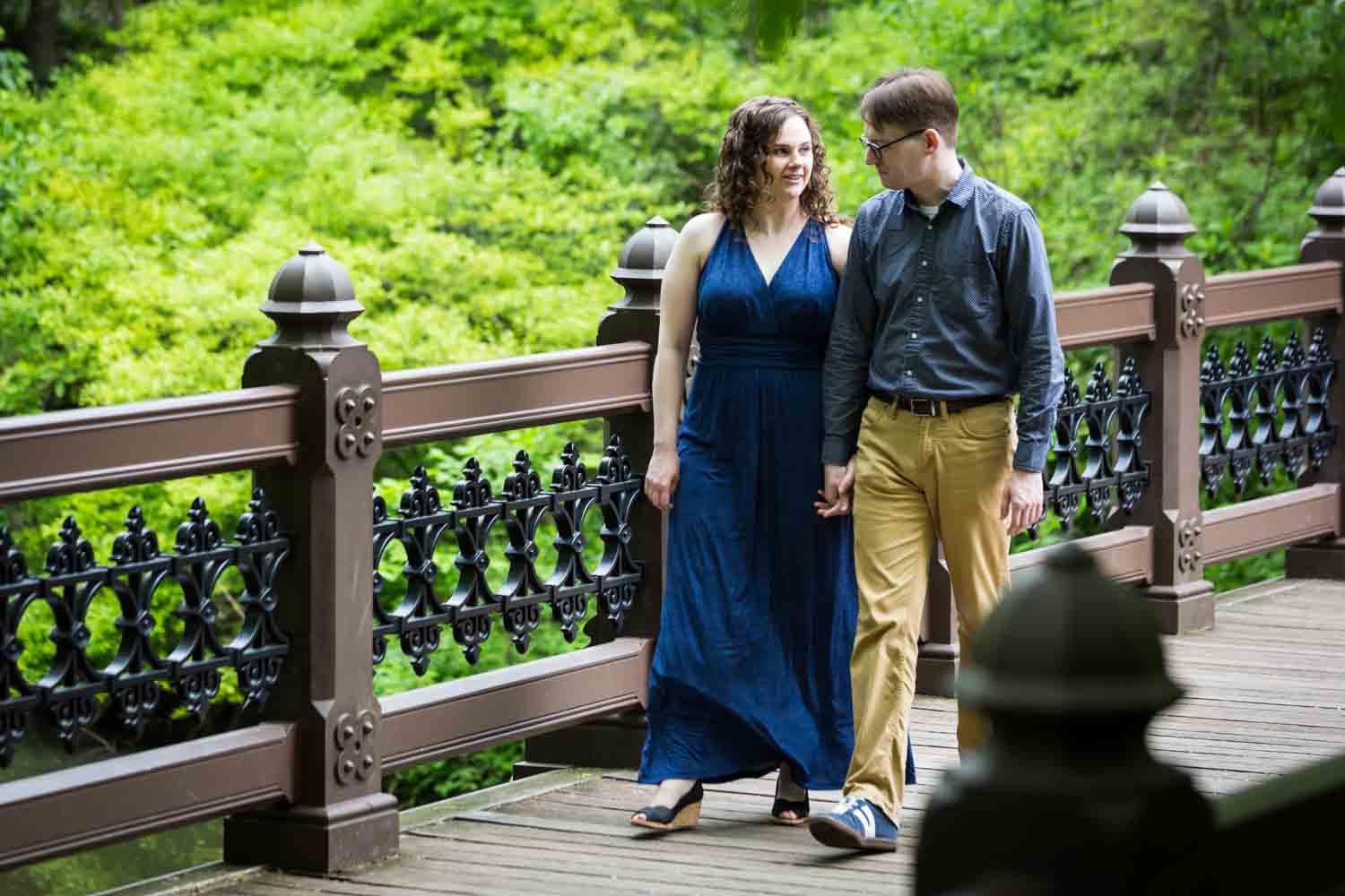 Couple walking on Oak Bridge in Central Park